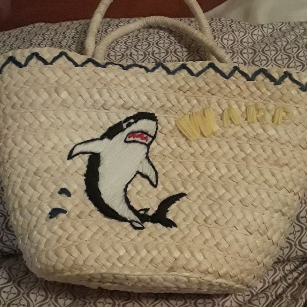 Straw purse with shark embroidered on front